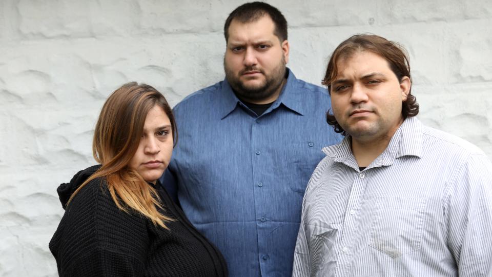 LaRosa, center, pictured with his sister, Johanna, and brother, Carmen, following the deaths of their parents in October 2020.