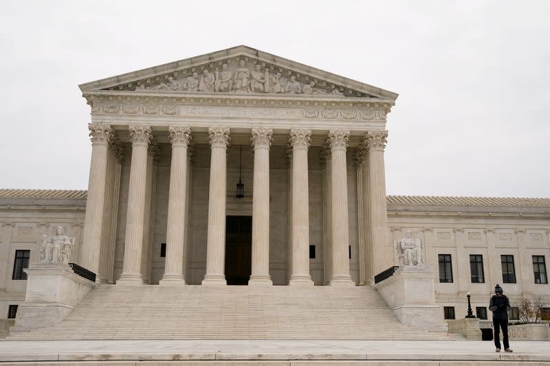 Blake Fox, of Washington, listens to a live broadcast of the U.S. Supreme Court arguments in Carson v. Makin, in Washington