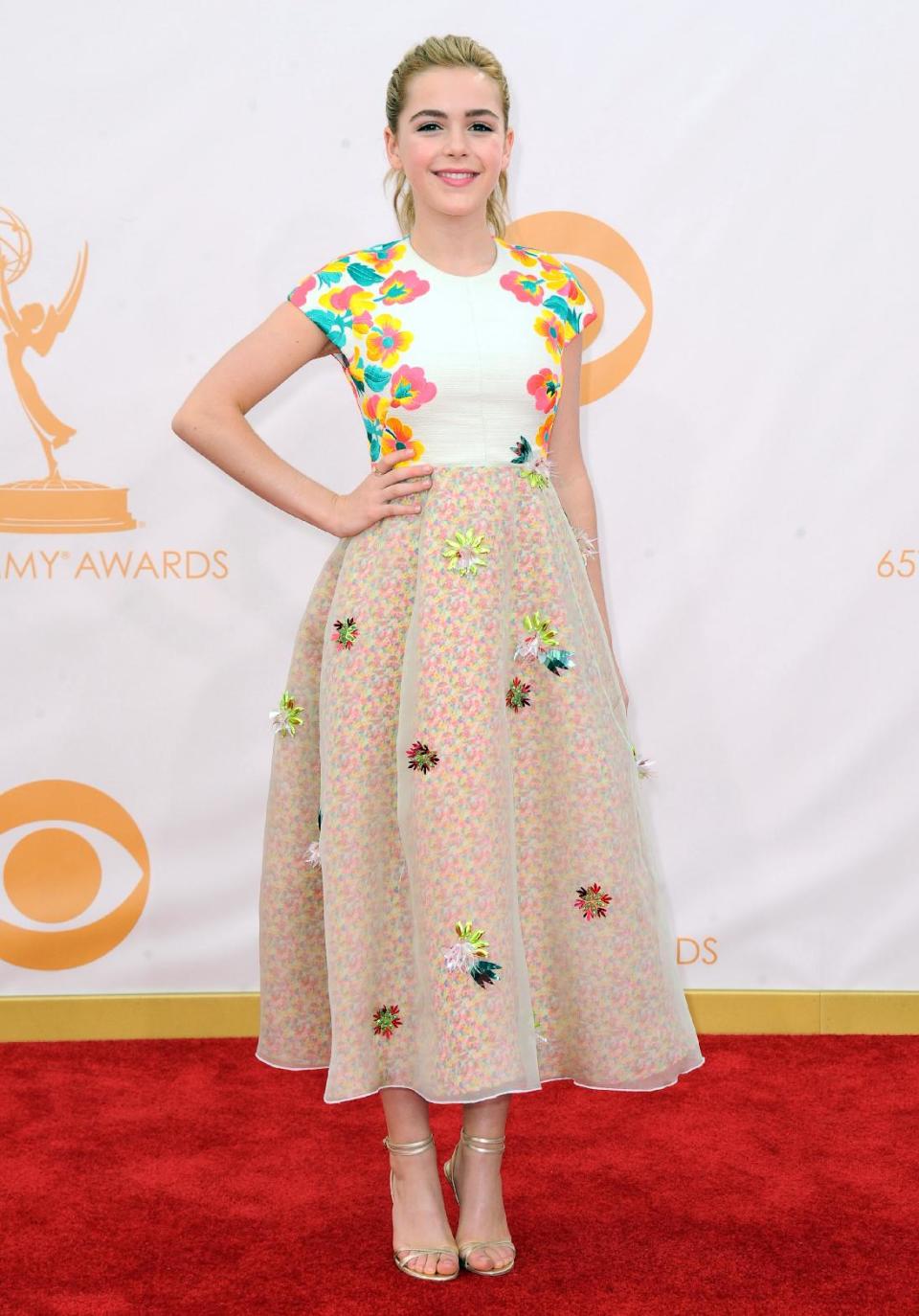 FILE - This Sept. 22, 2013 file photo shows Kiernan Shipka wearing a DelPozo dress at the 65th Primetime Emmy Awards at Nokia Theatre in Los Angeles. Shipka landed on several best-dressed lists after wearing the floral dress. DelPozo, a Spanish brand, is back in New York this week showing its fall-winter collection during Fashion Week. It’s the brand’s third time at the New York shows. (Photo by Jordan Strauss/Invision/AP, File)