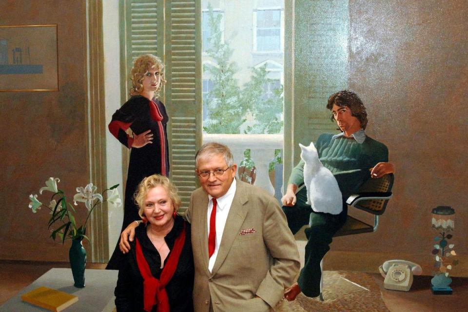 David Hockney stands in front of his painting Mr & Mrs Clark and Percy, painted in 1970, with Celia Birtwell, who modelled for the picture, at the National Portrait Gallery in London (PA)