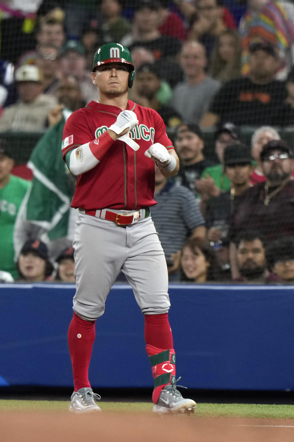 Mexico's Luis Urias celebrates after getting a base hit during the second inning of a World Baseball Classic game against Japan, Monday, March 20, 2023, in Miami. (AP Photo/Wilfredo Lee)