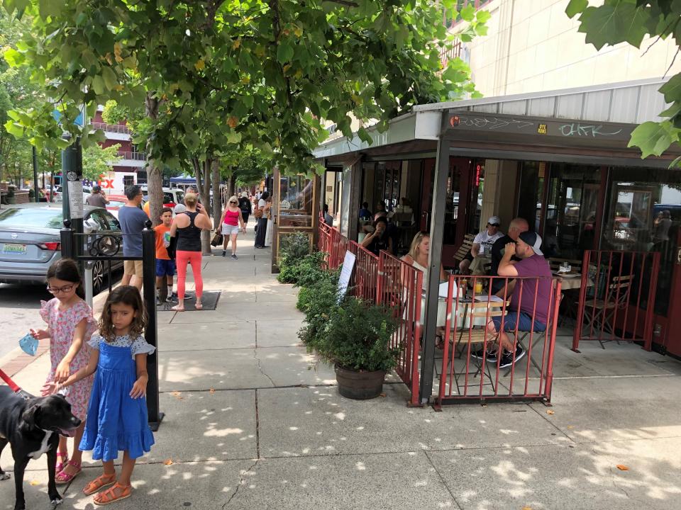 On the afternoon of Friday, Aug. 6, 2021, Asheville's downtown was bustling with tourists near Pritchard Park.