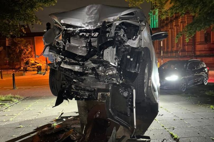 A car crashes into the Victoria Wood statue in Bury