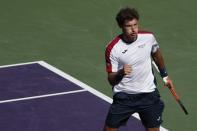 Mar 29, 2018; Key Biscayne, FL, USA; Pablo Carreno Busta of Spain celebrates after winning the first set against Kevin Anderson of South Africa (not pictured) on day ten of the Miami Open at Tennis Center at Crandon Park. Mandatory Credit: Geoff Burke-USA TODAY Sports