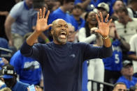 Orlando Magic head coach Jamahl Mosley directs his players on the court during the first half of Game 6 of an NBA basketball first-round playoff series against the Cleveland Cavaliers, Friday, May 3, 2024, in Orlando, Fla. (AP Photo/John Raoux)