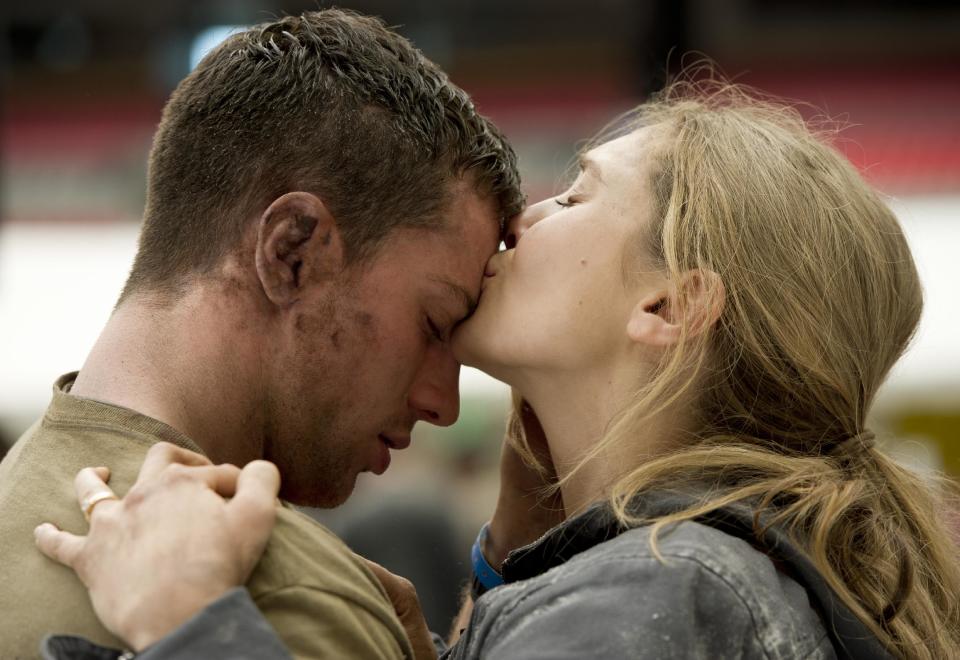 This film image released by Warner Bros. Pictures shows Aaron Taylor-Johnson, left, and Elizabeth Olsen in a scene from "Godzilla." (AP Photo/Warner Bros. Pictures, Kimberley French)