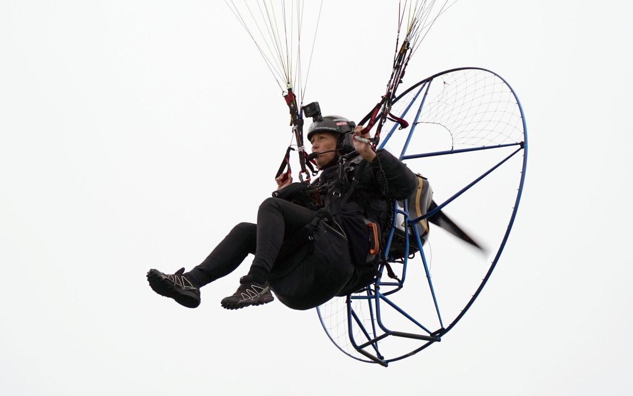 Paramotorist Sacha Dench in flight - PA