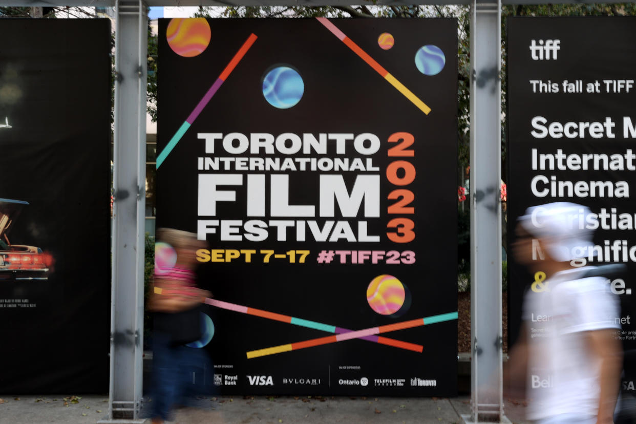 TORONTO, CANADA - SEPTEMBER 5 :  People walk past billboards promoting the 2023 Toronto International Film Festival, TIFF, is seen in Toronto, Canada on September 5, 2023. (Photo by Mert Alper Dervis/Anadolu Agency via Getty Images)