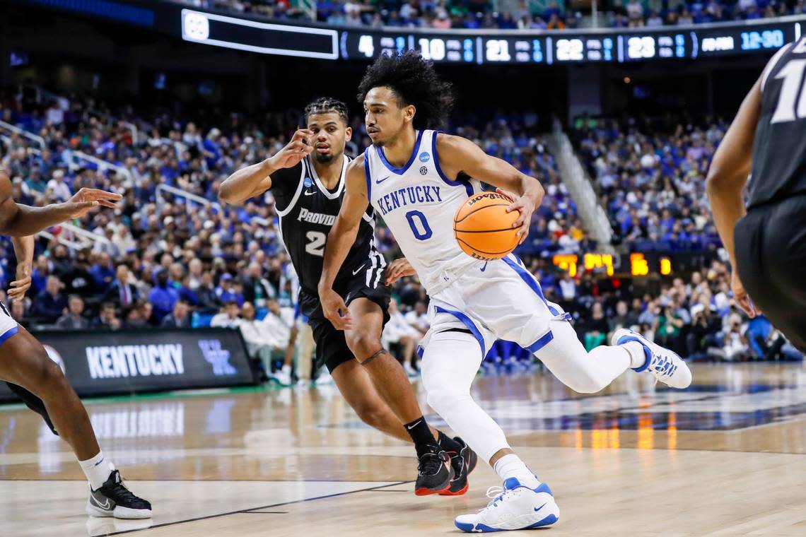 Kentucky’s Jacob Toppin (0) drives around Providence’s Bryce Hopkins (23) during their NCAA Tournament first-round game at Greensboro (N.C.) Coliseum on Friday.