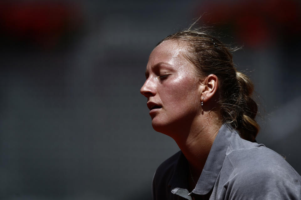 Petra Kvitova from Czech Republic reacts during a Madrid Open tennis tournament match against Simona Halep from Romania in Madrid, Spain, Saturday, May 10, 2014 . (AP Photo/Daniel Ochoa de Olza)