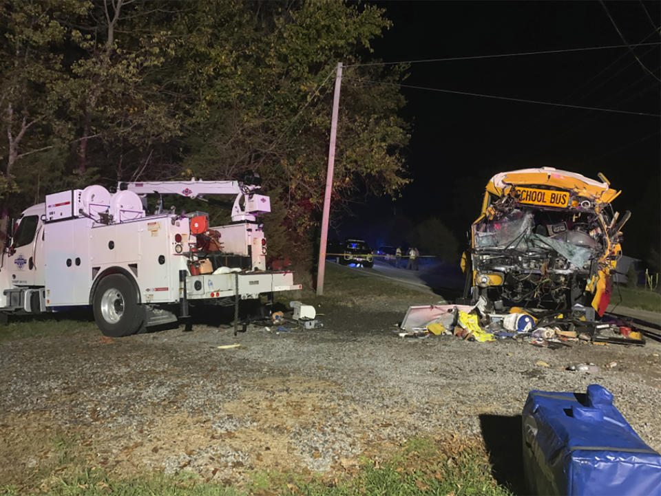 This photo provided by the Tennessee Highway Patrol shows the scene of deadly crash involving a utility vehicle and a school bus carrying children on Tuesday evening, Oct. 27, 2020, in Decatur, Tenn. (Tennessee Highway Patrol via AP)