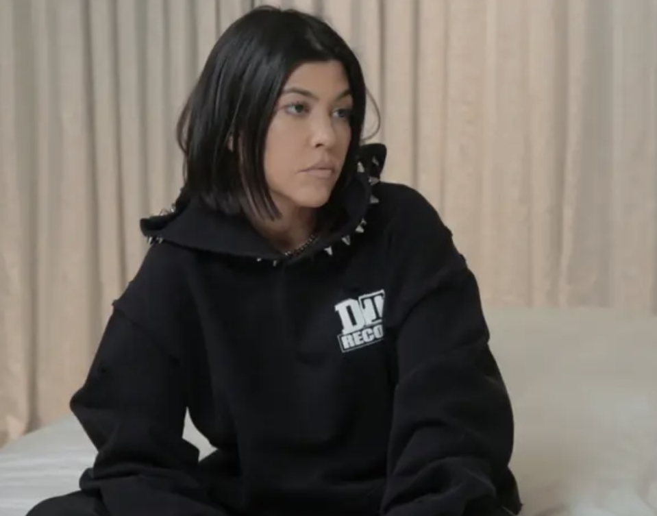 Kourtney looking annoyed