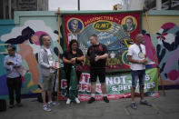 FILE - Workers and members of the RMT (The National Union of Rail, Maritime and Transport Workers) union stand on a picket line outside Paddington train station, in London, during a railway workers strike, on June 23, 2022. As food costs and fuel bills soar, inflation is plundering people’s wallets, sparking a wave of protests and workers’ strikes around the world. (AP Photo/Matt Dunham)