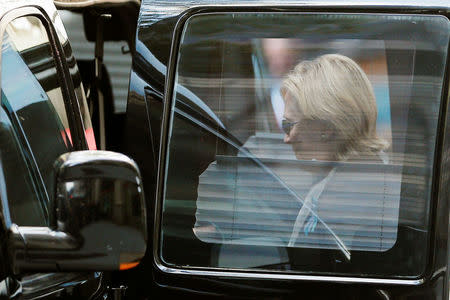 U.S. Democratic presidential candidate Hillary Clinton climbs into her van outside her daughter Chelsea's home in New York, New York, United States September 11, 2016, after Clinton left ceremonies commemorating the 15th anniversary of the September 11 attacks feeling "overheated." REUTERS/Brian Snyder