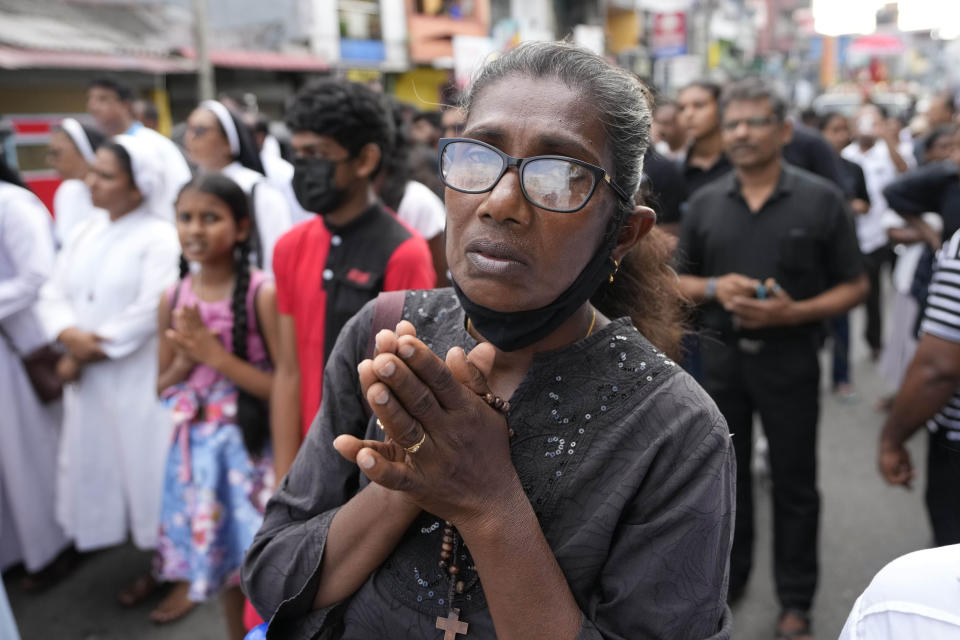 Sri Lankan Catholics with others take out a silent march to mark the fourth year commemoration of the 2019, Easter Sunday bomb attacks on Catholic Churches, in Colombo, Sri Lanka, Friday, April 21, 2023. Thousands of Sri Lankans held a protest in the capital on Friday, demanding justice for the victims of the 2019 Easter Sunday bomb attacks that killed nearly 270 people. (AP Photo/Eranga Jayawardena)