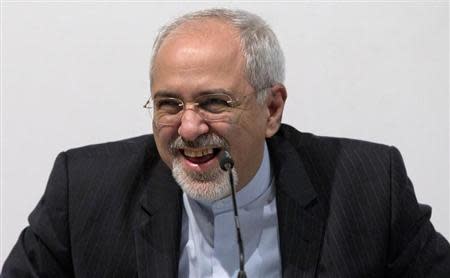 Iranian Foreign Minister Mohammad Javad Zarif smiles as he speaks to the media at the International Conference Centre of Geneva in Geneva November 24, 2013. REUTERS/Carolyn Kaster/Pool