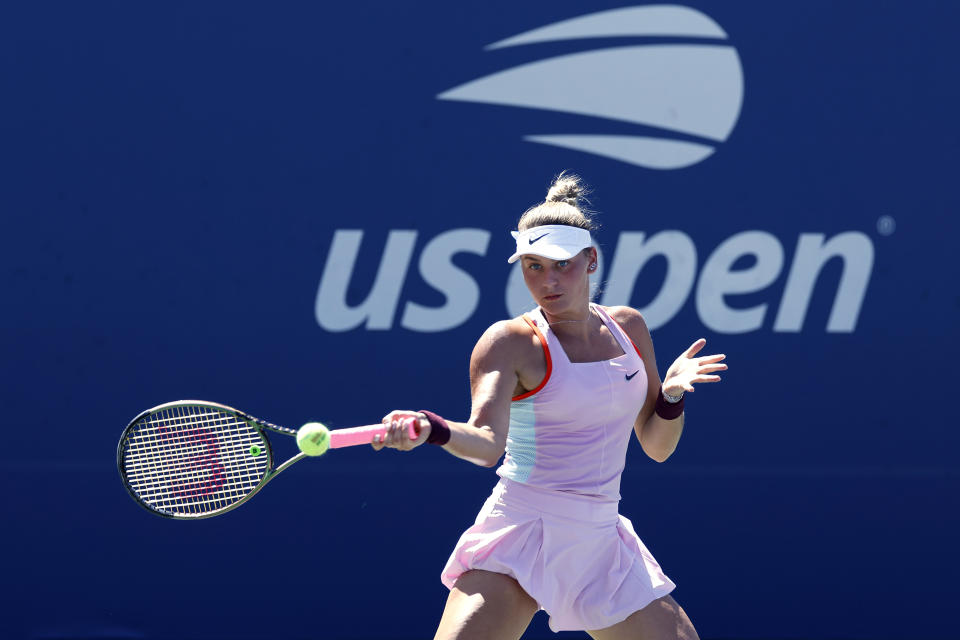 Pictured here, Ukraine's Marta Kostyuk plays a forehand against Victoria Azarenka in their second round match at the US Open. 