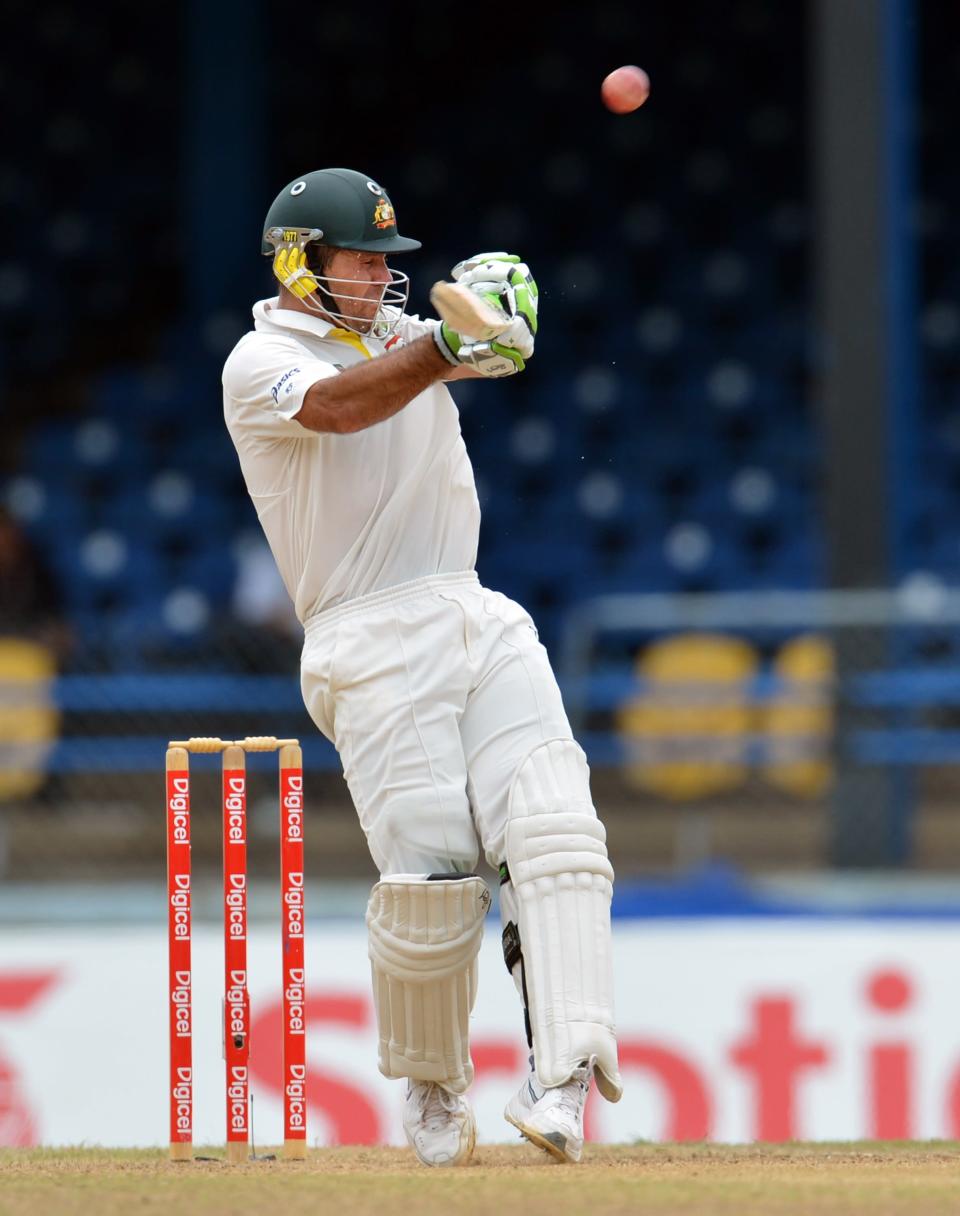 Australian batsman Ricky Ponting plays a shot that was caught out by West Indies cricketer Kieran Powell during the final day of the second-of-three Test matches between Australia and West Indies April19, 2012 at Queen's Park Oval in Port of Spain, Trinidad.