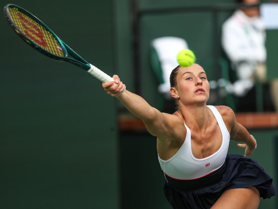 Marta Kostyuk hits a shot in the womens semifinal match against Iga Swiatek at the BNP Paribas Open in Indian Wells, Calif., March15, 2024.