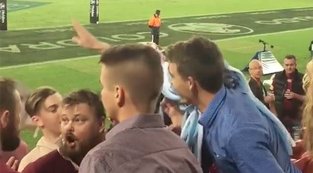 'Origin banter' escalated into something a lot more vicious when a NSW fan flicked a Queensland fan's hat off. Source: Supplied