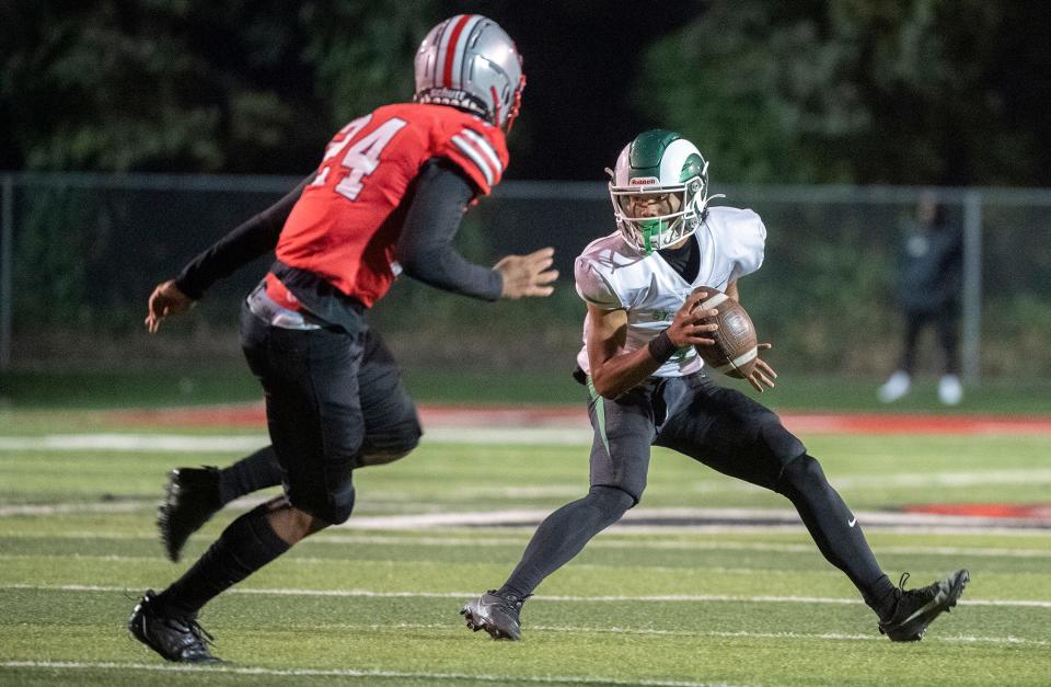 St. Mary's Samson Hunkin, right, makes a move on Lincoln's Tristan Walker during a varsity football game at Lincoln's Spanos Stadium in Stockton on Oct. 27, 2023.