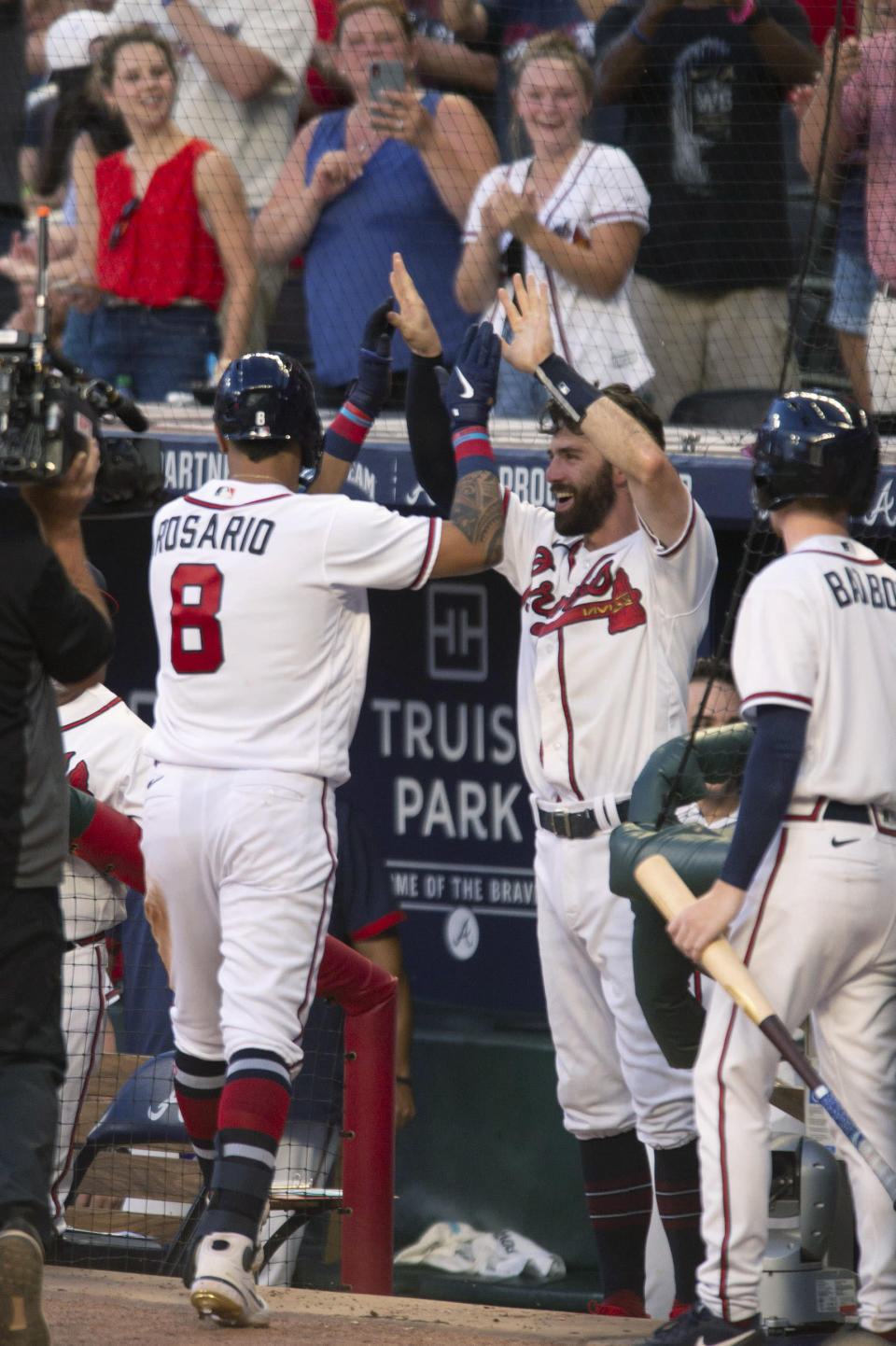 Atlanta Braves' Eddie Rosario (8) celebrates with Dansby Swanson after hitting a home run against the St. Louis Cardinals during the fifth inning of a baseball game Wednesday, July 6, 2022, in Atlanta. (AP Photo/Edward M. Pio Roda)