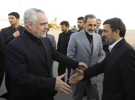 Mohammad Reza Rahimi (L) welcomes Iran's Mahmoud Ahmadinejad (R) as Ali Akbar Velayati, senior advisor to Ayatollah Ali Khamenei looks on at Tehran's Mehrabad airport after a trip to Latin American countries January 14, 2012. REUTERS/Raheb Homavandi