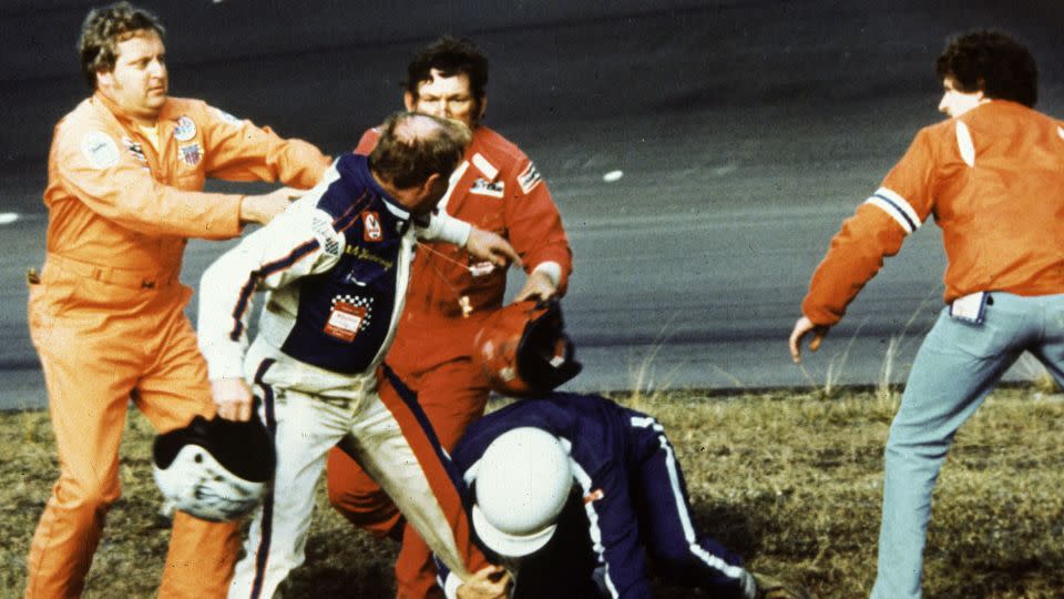 Yarborough (with helmet in right hand) brawls with Donnie Allison (helmet in left hand) and Bobby Allison (in blue) after a final lap crash ended their chances of winning the 1979 Daytona 500. - RacingOne/ISC Archives/CQ-Roll Call Group/Getty Images