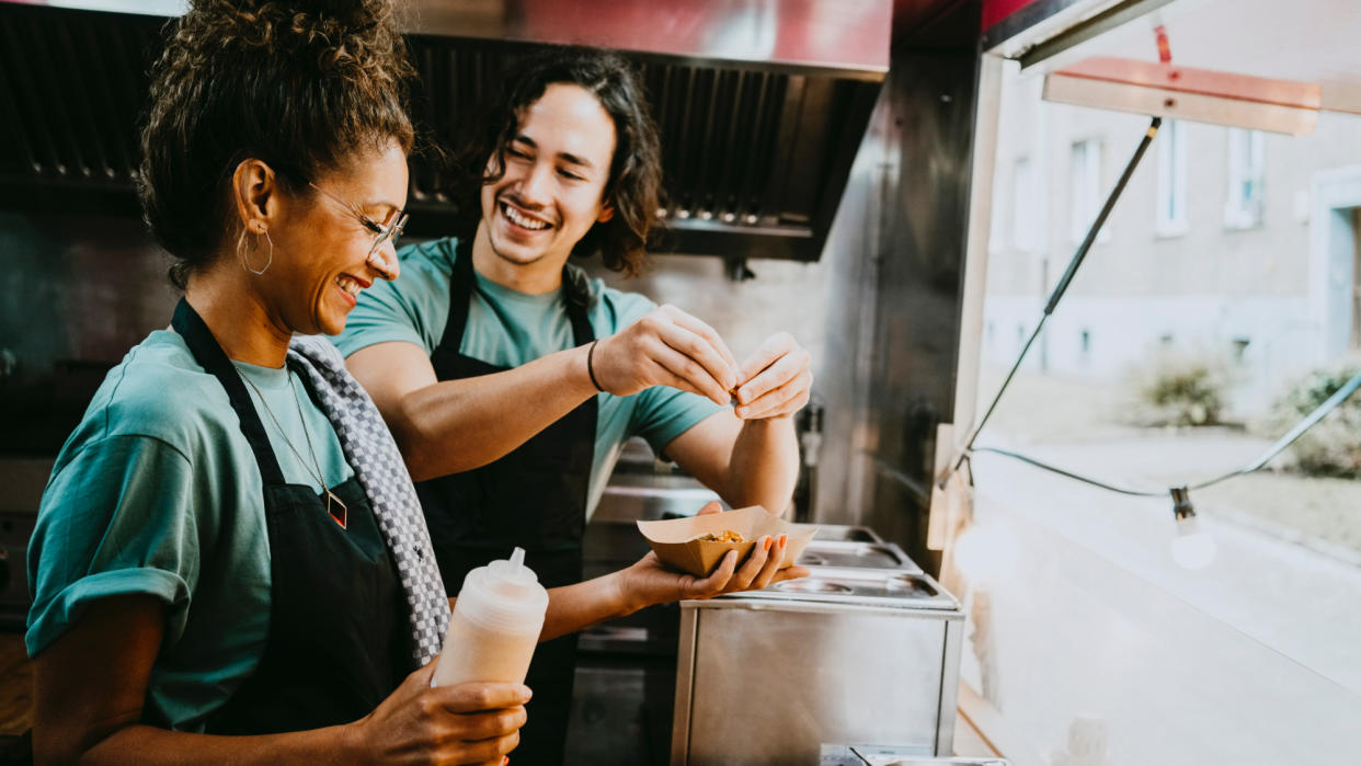  Two food truck workers. 