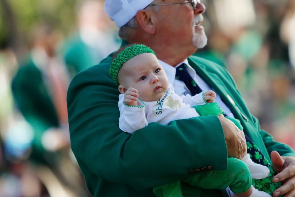 A young parade participant enjoys their first Savannah St. Patrick's Day Parade in Savannah, GA Thursday, March 17, 2022.