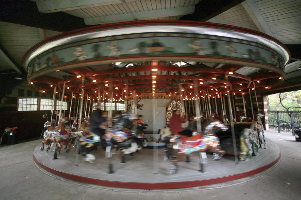 FILE - This Nov. 14, 2007 file photo shows the carousel in Central Park, in New York. New York City will terminate business contracts with President Donald Trump after last week's insurrection at the U.S. Capitol, Mayor Bill de Blasio announced Wednesday, Jan. 13, 2021. The Trump Organization is under city contract to operate the two ice rinks and a carousel in Central Park as well as a golf course in the Bronx. (AP Photo/Bebeto Matthews, File)