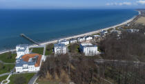 The beach promenade close to the 'MEDIAN Clinic Heiligendamm' is pictured in Heiligendamm, northern Germany, Wednesday, April 14, 2021. The MEDIAN Clinic, specialized on lung diseases, treats COVID-19 long time patients from all over Germany. (AP Photo/Michael Sohn)