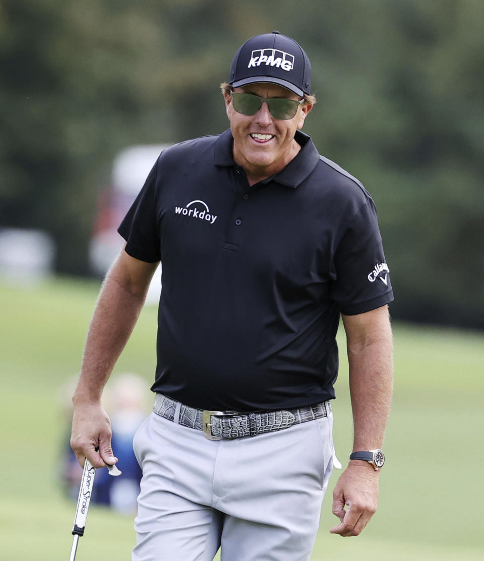 Winner Phil Mickelson walks up 18th green during final round play in the Dominion Energy Charity Classic at the Country Club of Virginia in Richmond, Virginia, on Sunday, October 18, 2020. Mickelson finished 3 strokes ahead of Canada's Mike Weir. (Joe Mahoney/Richmond Times-Dispatch via AP)