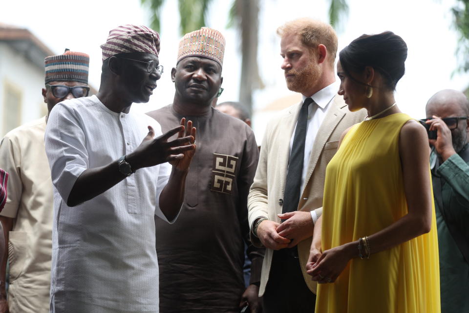 Lagos State Governor, Babajide Sanwo-Olu (L), and Nigeria Chief of Defense Staff Christopher Musa (2ndL), welcome Britain's Prince Harry (2ndR), Duke of Sussex, and Britain's Meghan (R), Duchess of Sussex, as they arrive at the State Governor House in Lagos on May 12, 2024 as they visit Nigeria as part of celebrations of Invictus Games anniversary.