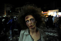 <p>A woman dressed as zombie walks through the city centre during an annual “Zombie Walk” parade in Athens, Greece, February 25, 2017. (Michalis Karagiannis/Reuters) </p>