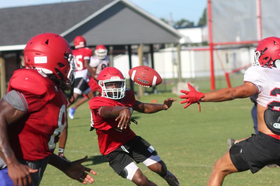 Jacksonville quarterback Jai'kei Taylor leads the Cardinals' offense during a recent practice. 