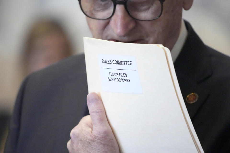 Mississippi State Senate President Pro Tempore Sen. Dean Kirby, R-Pearl, holds a folder with files for the Senate Rules Committee, in the Senate Chamber at the state Capitol in Jackson, Miss., Thursday, May 2, 2024. (AP Photo/Rogelio V. Solis)