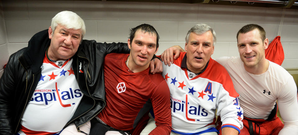 <p>Washington Capitals right winger Alex Ovechkin (8) and center Brooks Laich (21) pose with their dads, Mikhail Ovechkin and Harold Laich following their 5-0 win over the Montreal Canadiens during the annual trip where dads, brothers and friends come along on a road trip with the Washington Capitals on January, 26 2014 in Montreal, Canada (Photo by Jonathan Newton / The Washington Post via Getty Images) </p>