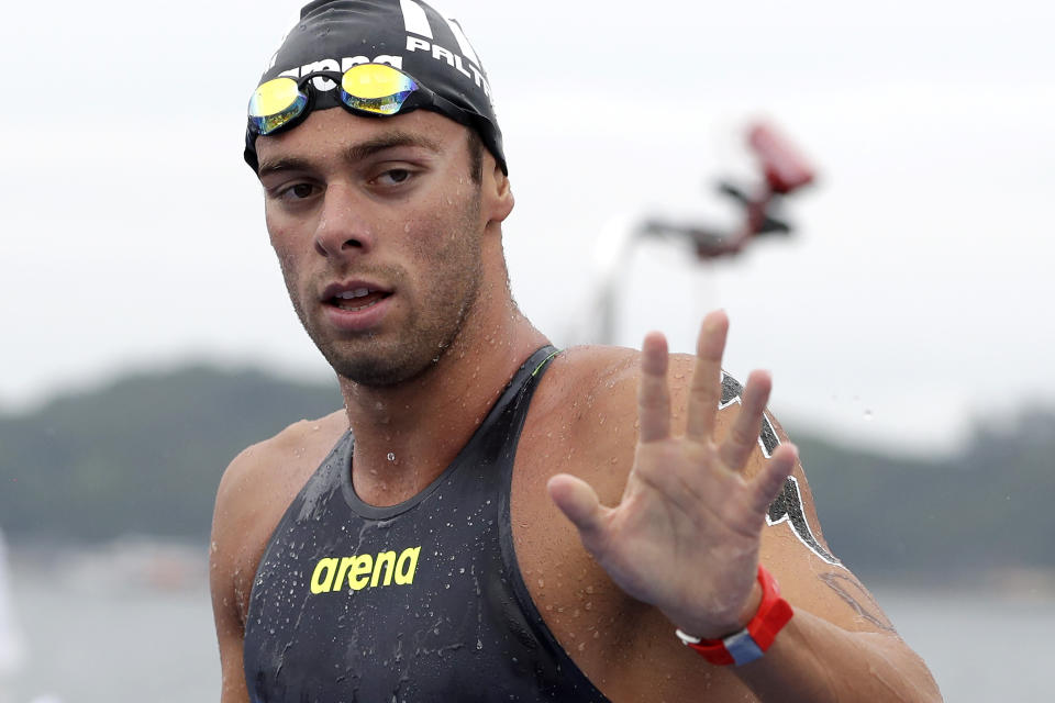 Gregorio Paltrinieri of Italy reacts after the 5km mixed relay open water swim at the World Swimming Championships in Yeosu, South Korea, Thursday, July 18, 2019. (AP Photo/Mark Schiefelbein)