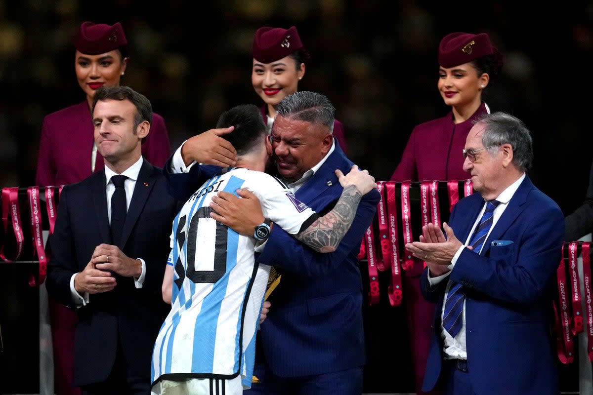 Argentina captain Lionel Messi hugs Claudio Tapia, president of the Argentina Football Association, after leading his side to victory in Qatar (Nick Potts/PA) (PA Wire)