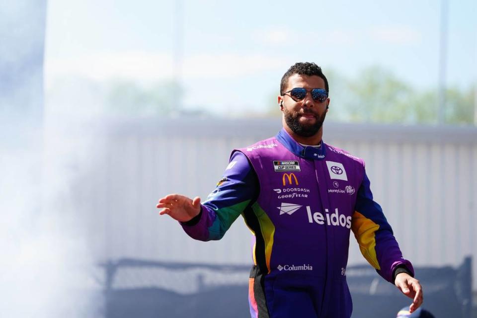 Apr 2, 2023; Richmond, Virginia, USA; Bubba Wallace waves to fans before the race during the Toyota Owners 400 at Richmond Raceway. Mandatory Credit: John David Mercer-USA TODAY Sports