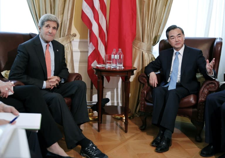 US Secretary of State John Kerry (L) and his Chinese counterpart Wang Yi (R) will attend the ASEAN Regional Forum, along with foreign ministers from Southeast Asia, Japan, the Koreas, and other nations