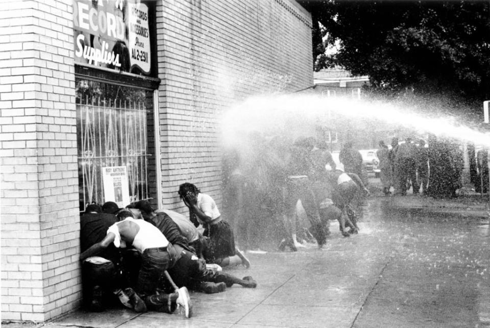 Police turned water cannons and dogs against Black children in Birmingham, Alabama protesting against segregation. The 1963 march was organized by Reverend Dr. Martin Luther King Jr. (Michael Ochs/Getty Images)