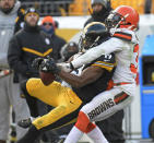 <p>Pittsburgh Steelers wide receiver JuJu Smith-Schuster (19) catches a pass with Cleveland Browns cornerback Jason McCourty (30) defending during the first half of an NFL football game in Pittsburgh, Sunday, Dec. 31, 2017. (AP Photo/Don Wright) </p>