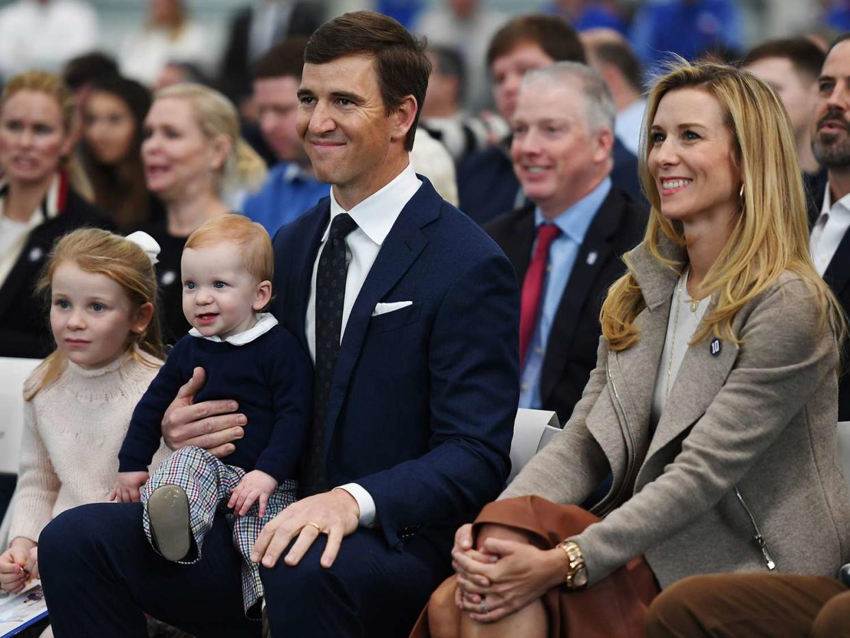 Eli Manning of the New York Giants looks on with his family during a press conference to announce his retirement on January 24, 2020 at Quest Diagnostics Training Center in East Rutherford, New Jersey. The two-time Super Bowl MVP is retiring after 16 seasons with the team