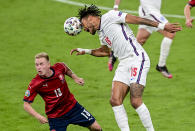 England's Tyrone Mings heads the ball away from Czech Republic's Petr Sevcik during the Euro 2020 soccer championship group D match between the Czech Republic and England at Wembley stadium, London, Tuesday, June 22, 2021. (Neil Hall/Pool Photo via AP)