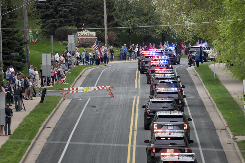 Police vehicles line up during the funeral service for St. Croix County Sheriff’s Deputy Kaitlin “Kaitie” R. Leising, Friday, May 12, 2023 in Hudson, Wis.. Hundreds of law enforcement officers from several states joined other mourners in paying final respects Friday to a Wisconsin sheriff’s deputy who was fatally shot by a suspected drunken driver during a traffic stop. (Glen Stubbe/Star Tribune via AP)