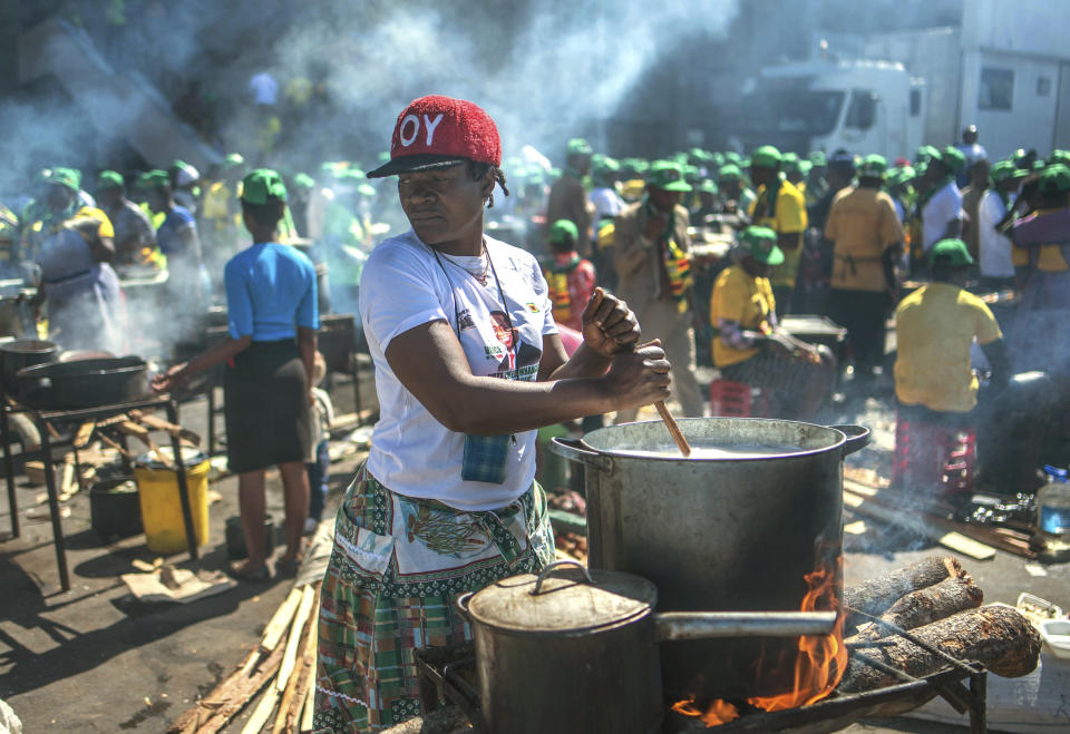 Women cook pots of food at a ruling party ZANU PF election rally in Harare, Zimbabwe, Saturday July 28, 2018. Zimbabwean President Emmerson Mnangagwa and main challenger Nelson Chamisa are set to hold final campaign rallies ahead of Monday's election in a country seeking to move past decades of economic and political paralysis. (AP Photo)