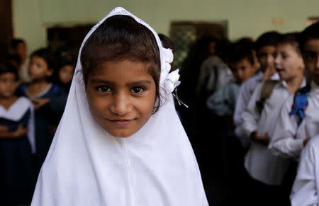 A girl attends morning assembly at the Mashal Model school in Islamabad, Pakistan, September 29, 2017. REUTERS/Caren Firouz