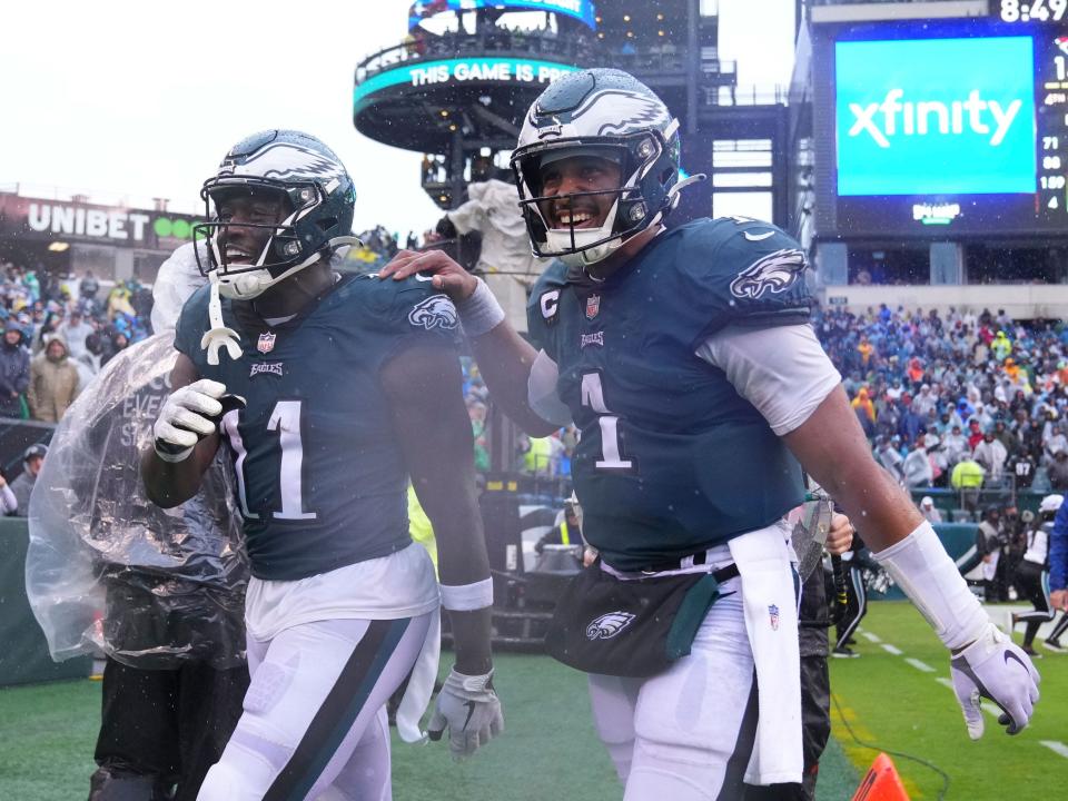 Jalen Hurts and A.J. Brown walk off the field after a win against the Jacksonville Jaguars.